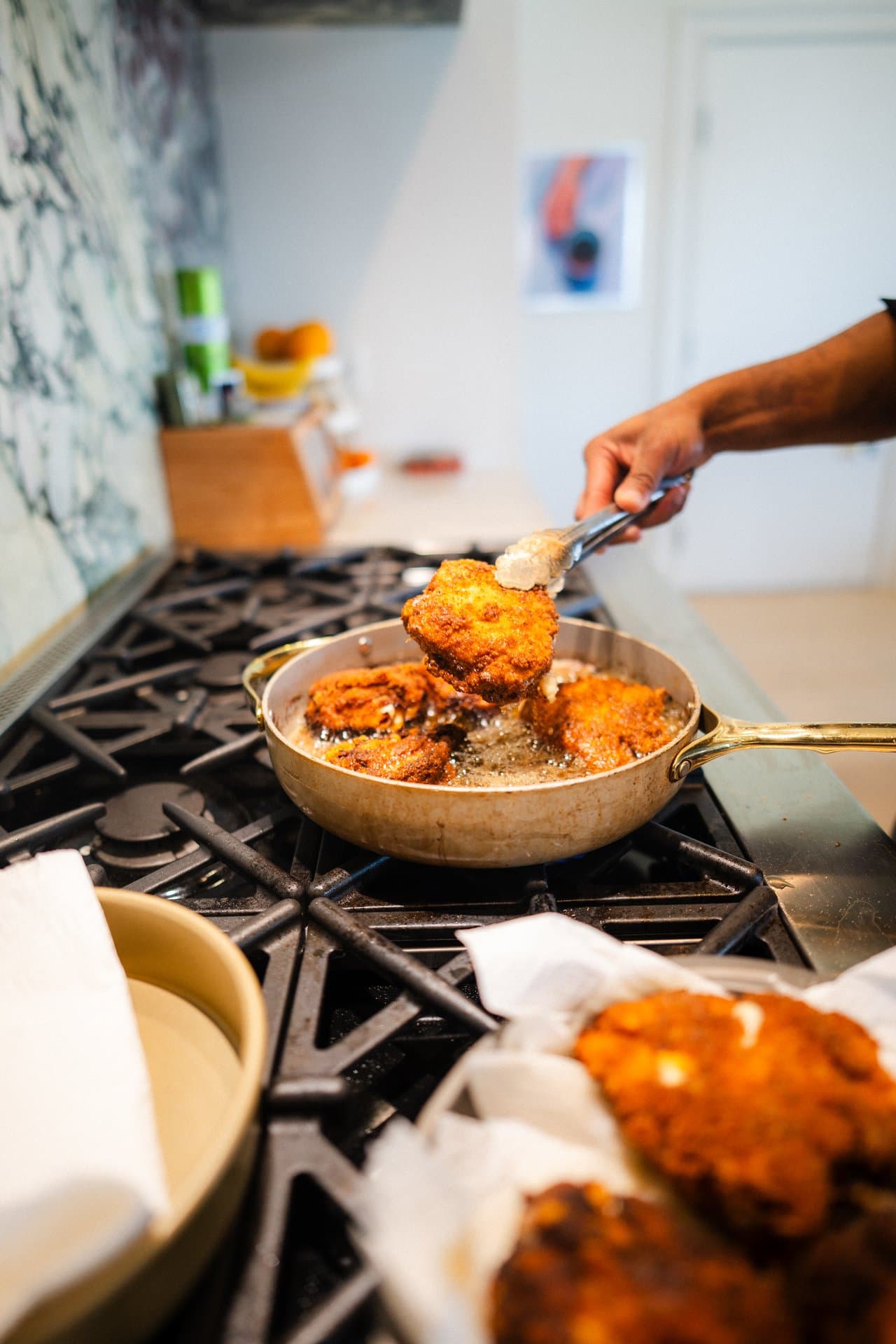 Chicken frying in a copper pan